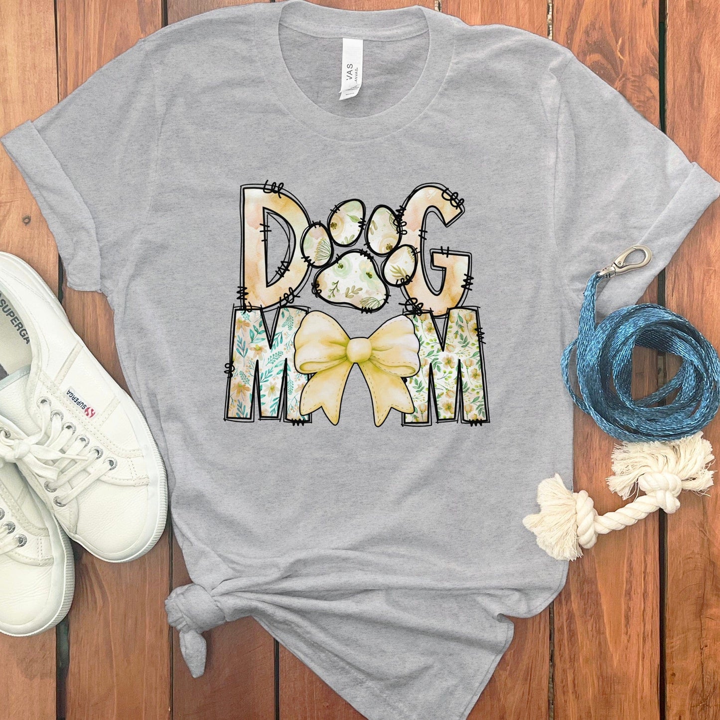 Dog Mom with Yellow Bow and Paw Graphic T-shirt product type