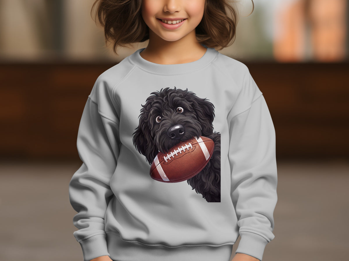 Black doodle dog with football graphic on a gray crewneck sweatshirt.