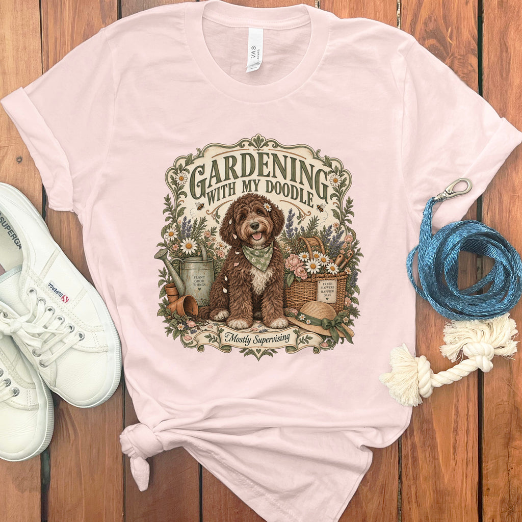 Pink t-shirt with doodle dog gardening graphic and text.