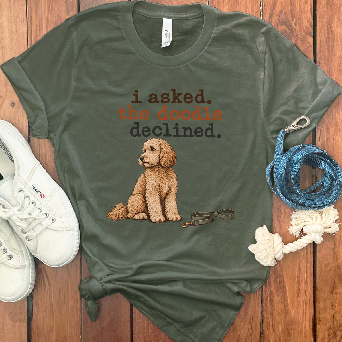 Green t-shirt with dog saying "i asked. the doodle declined."
