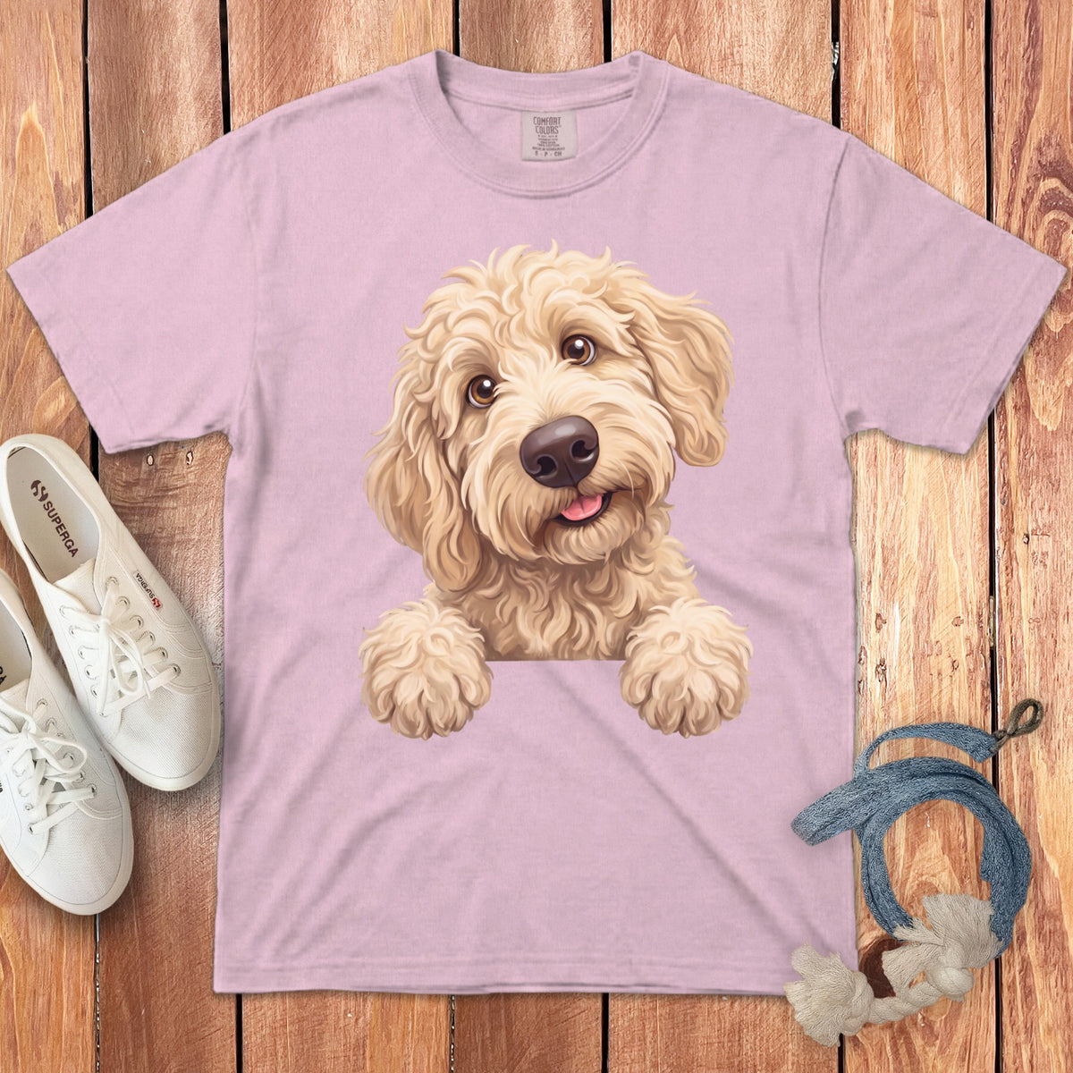 Pink t-shirt with a cream doodle dog illustration and Comfort Colors label.