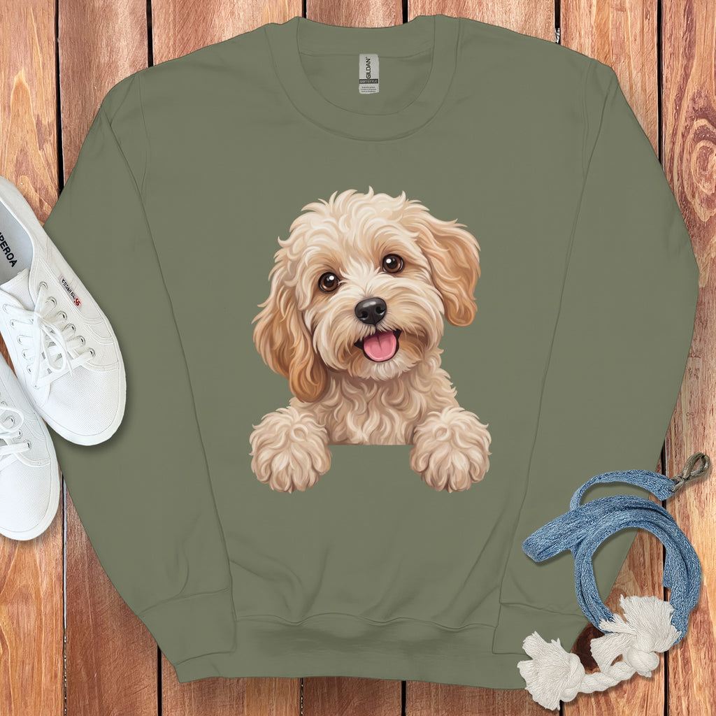 Olive green sweatshirt with a watercolor illustration of a fluffy cream-colored dog.