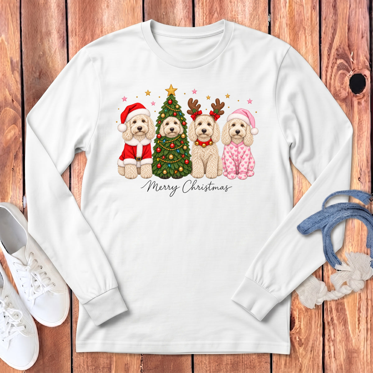 White long-sleeve t-shirt featuring a Christmas graphic of four Poodles in festive costumes and the text Merry Christmas.