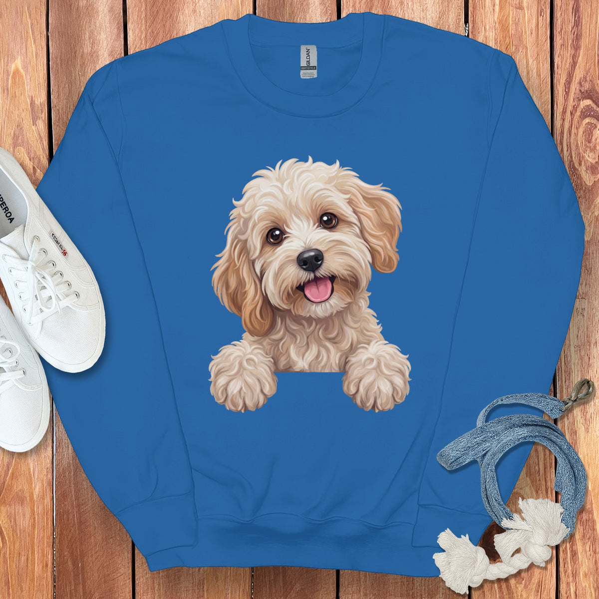 Blue sweatshirt with a happy dog illustration and white sneakers.