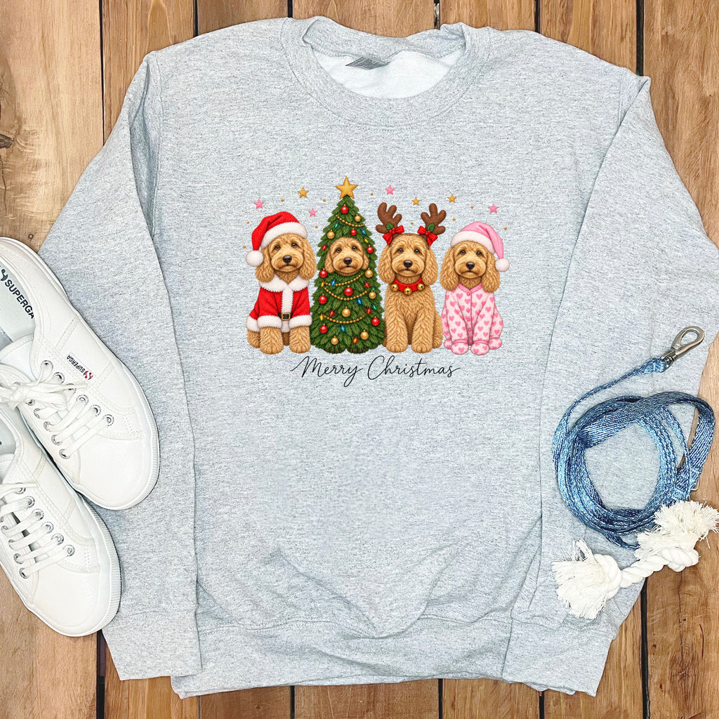 Light gray crewneck sweatshirt featuring a graphic of four doodle dogs celebrating Christmas, surrounded by sneakers and a leash.