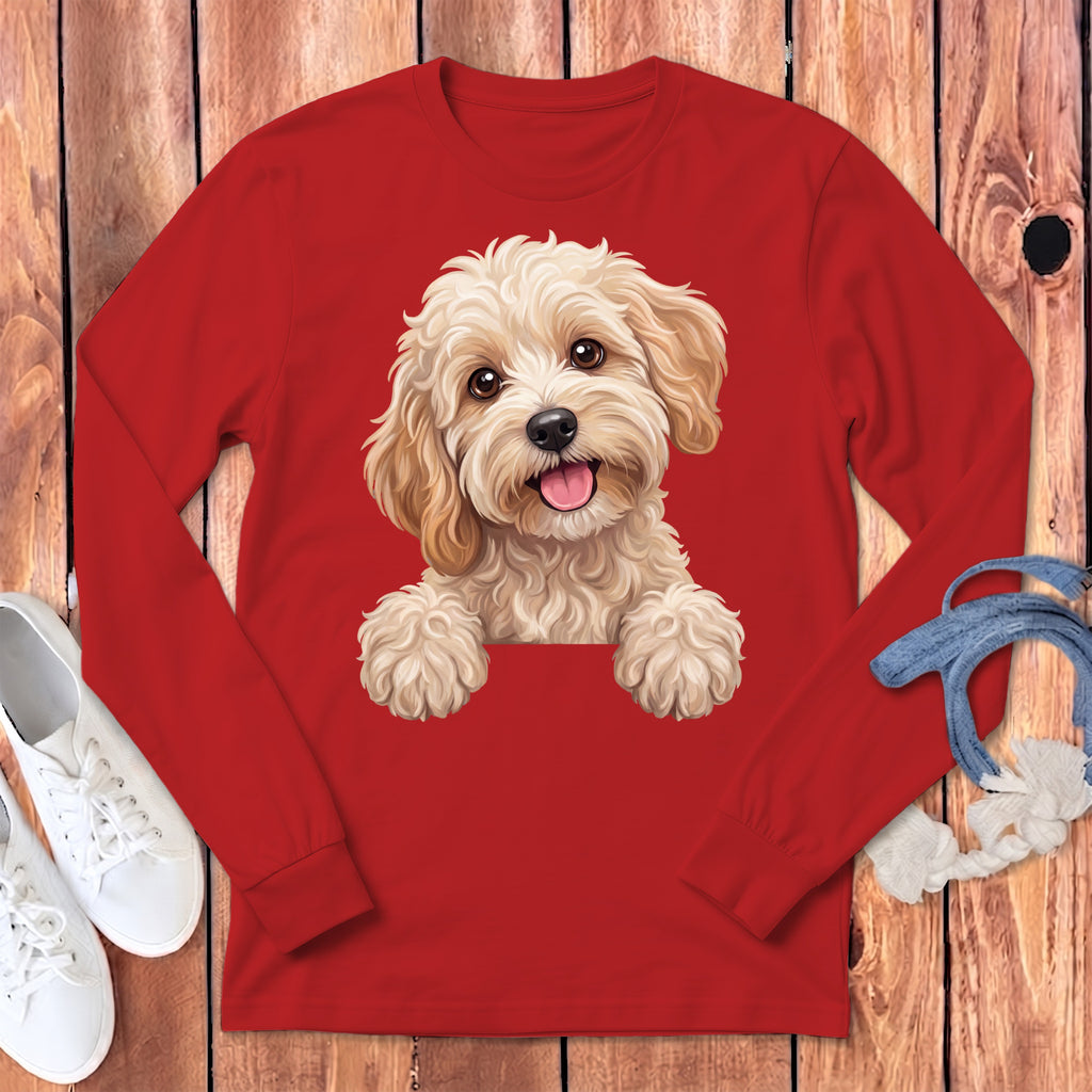 Red long-sleeved shirt with a smiling doodle of a golden doodle dog.