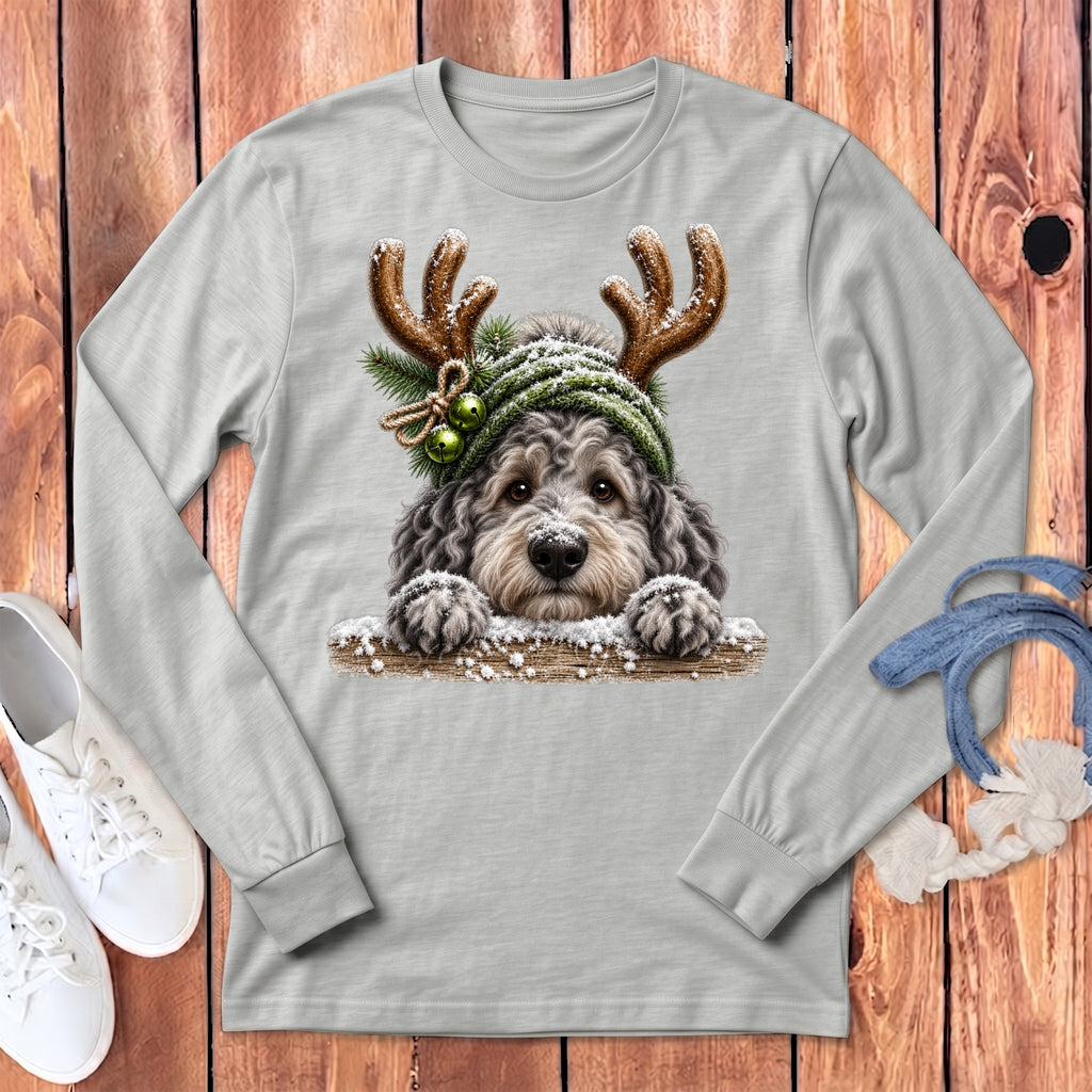 Long sleeve t-shirt with a doodle dog wearing antlers and a winter hat.