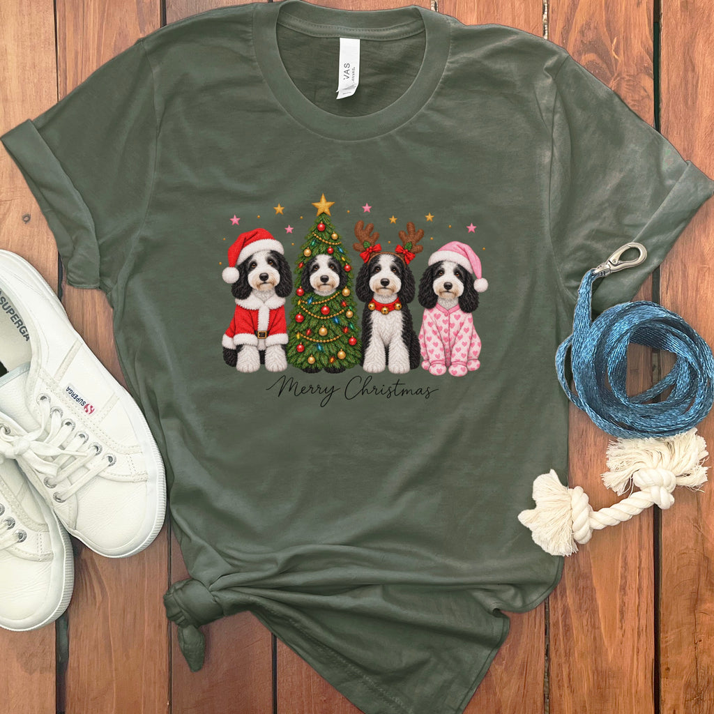 Olive green crewneck t-shirt featuring a Christmas graphic of four dogs, white sneakers, and a blue leash.