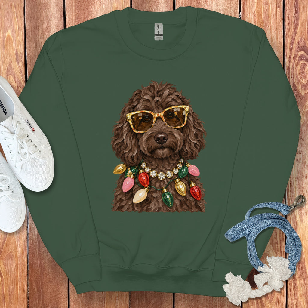 Green sweatshirt with a doodle wearing sunglasses and a Christmas light necklace.