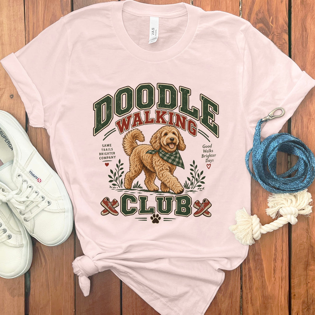 Pink t-shirt with "Doodle Walking Club" text and a cartoon dog.