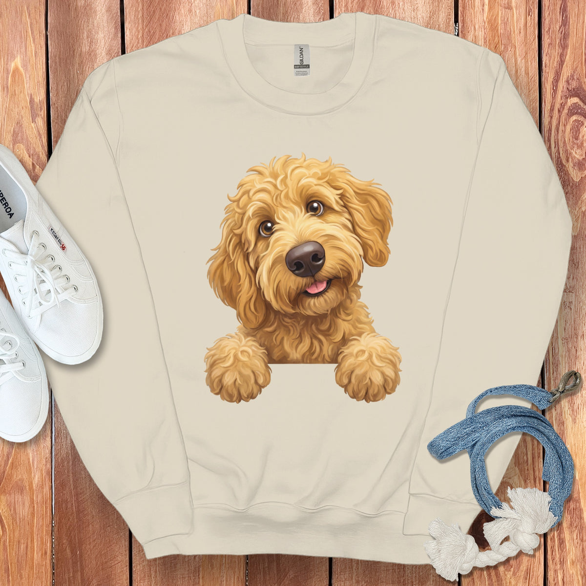 Light beige crewneck sweatshirt with a cartoon goldendoodle dog graphic.