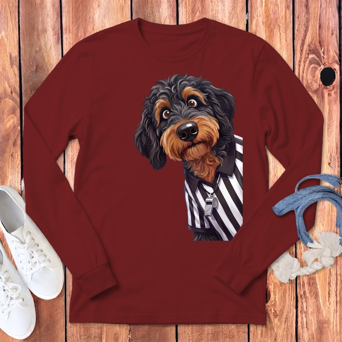 Maroon long-sleeve shirt featuring a black and tan dog wearing a referee uniform.