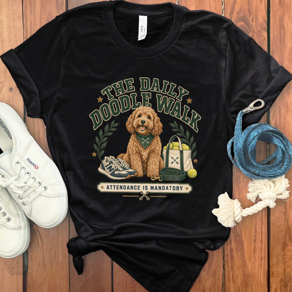 Black t-shirt with a doodle dog wearing a bandana, surrounded by dog walking accessories and text.