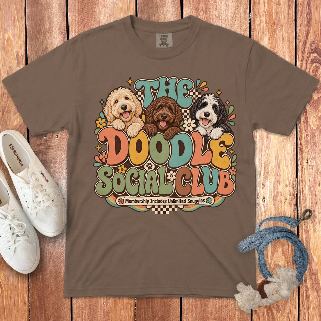 Brown t-shirt with "The Doodle Social Club" and three doodles in retro font.