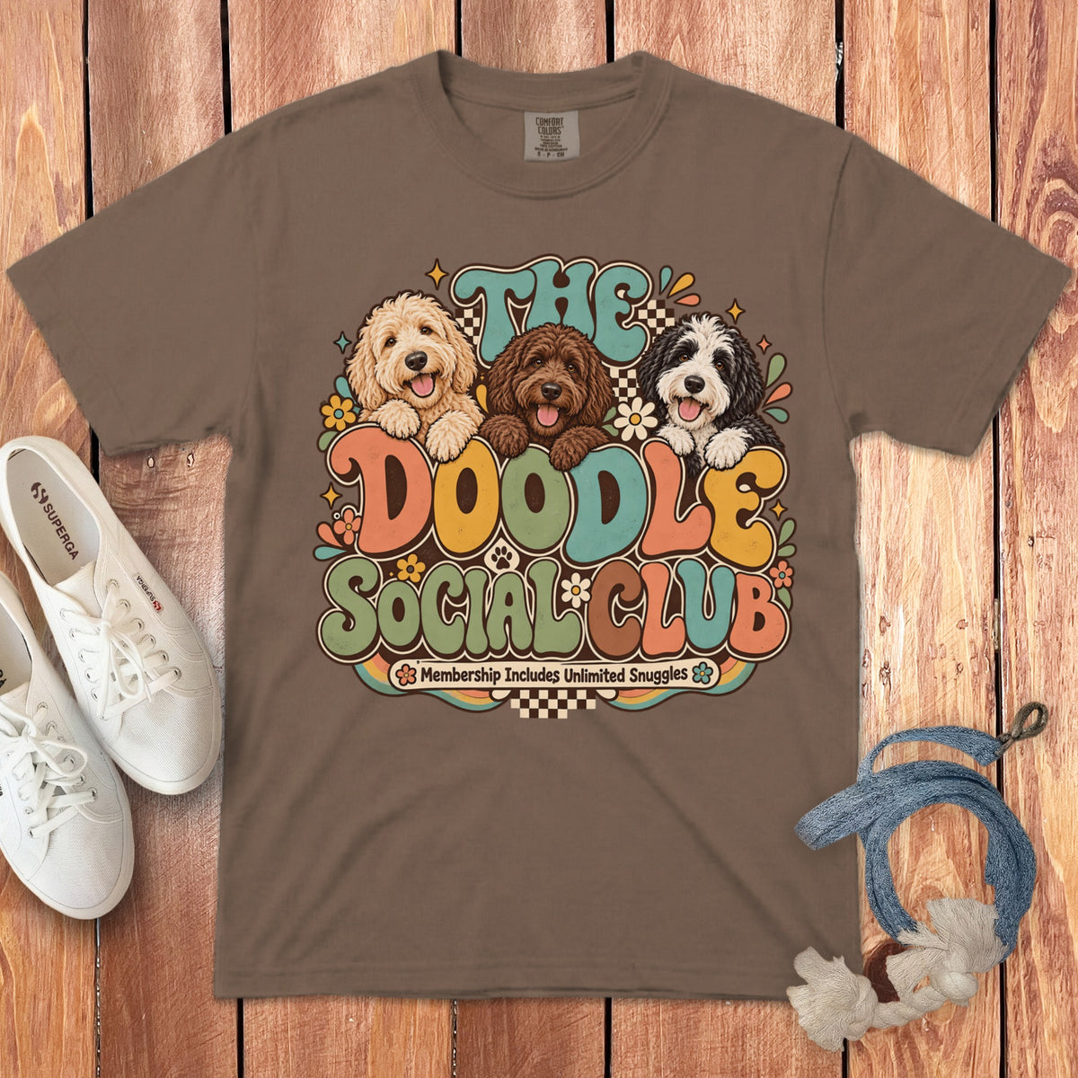 Brown t-shirt with "The Doodle Social Club" and three doodles in retro font.