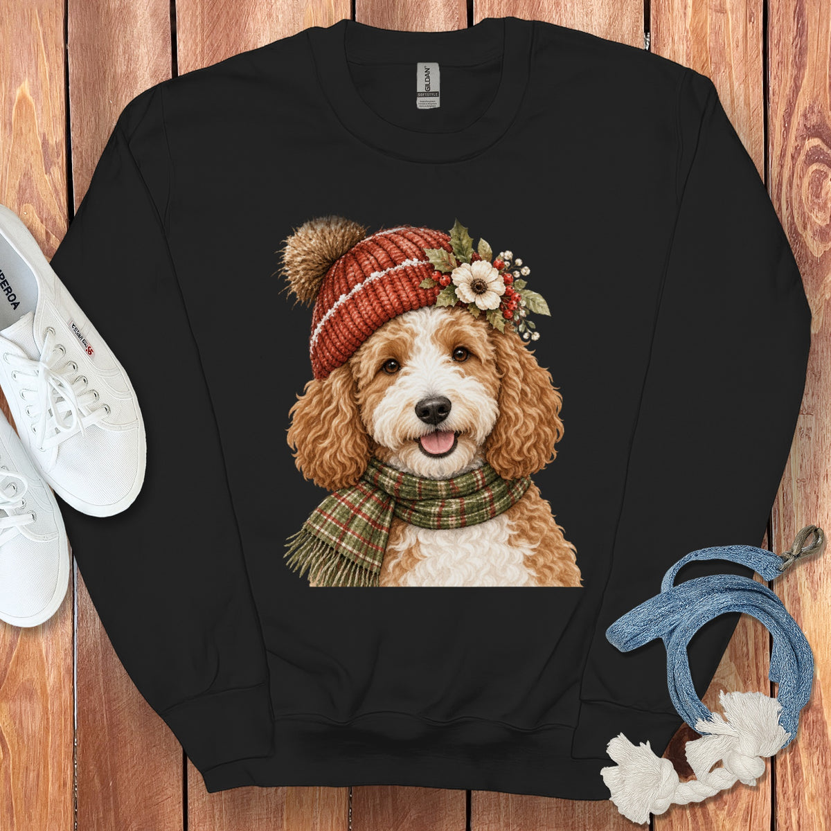 Black sweatshirt with watercolor illustration of a goldendoodle wearing a hat and scarf.