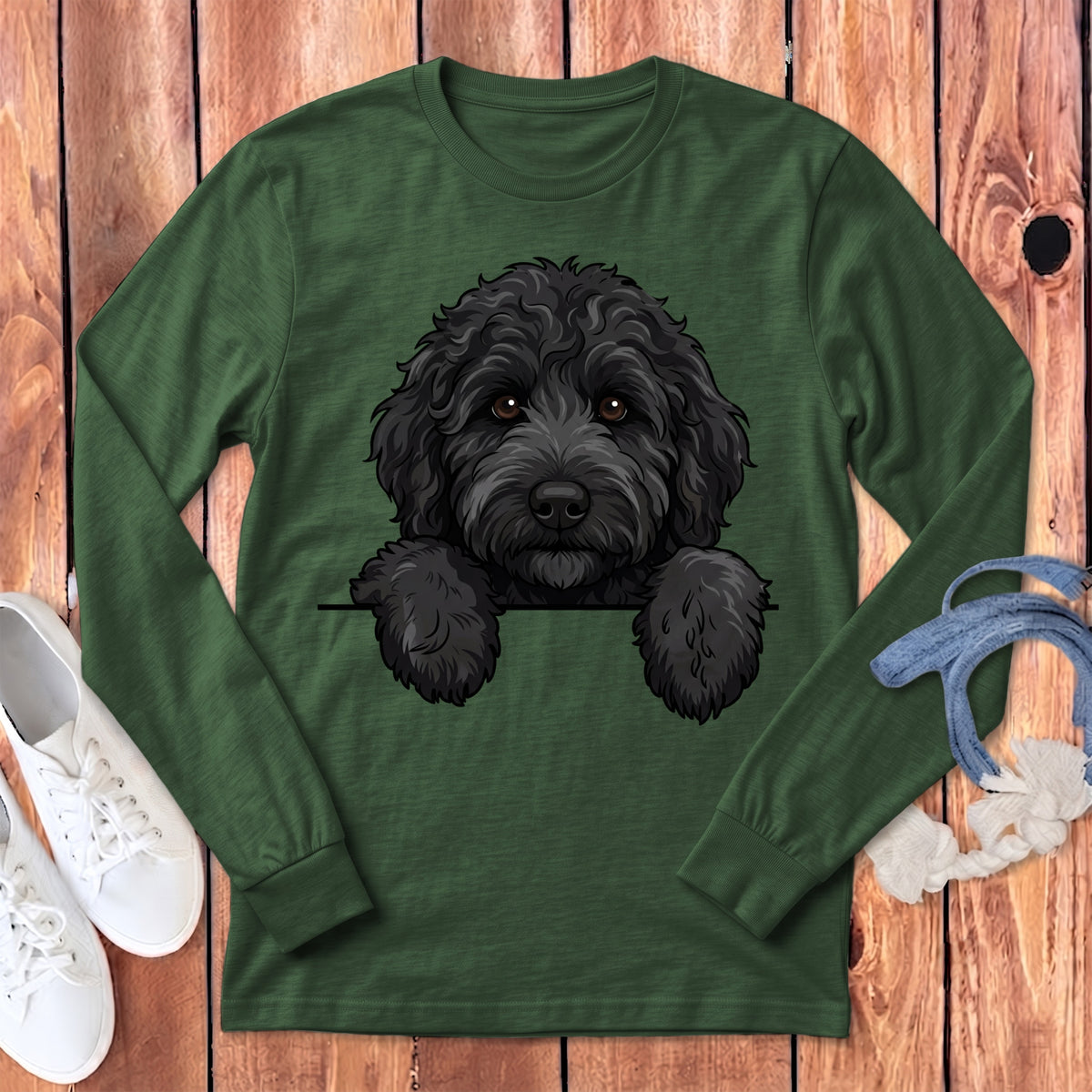 Dark green long-sleeve shirt featuring a cartoon black doodle dog peeking over the chest.