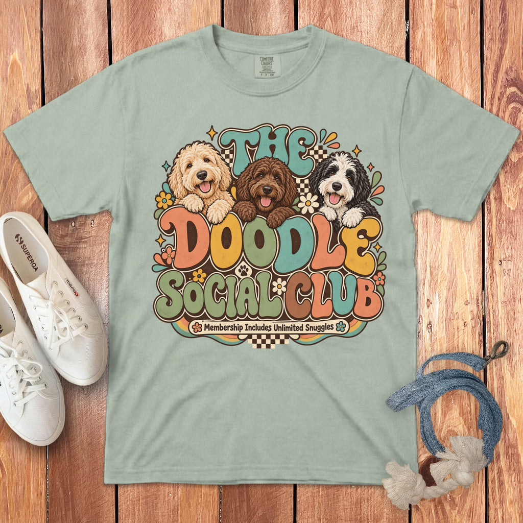 Light green t-shirt with "The Doodle Social Club" graphic and three doodle dogs.