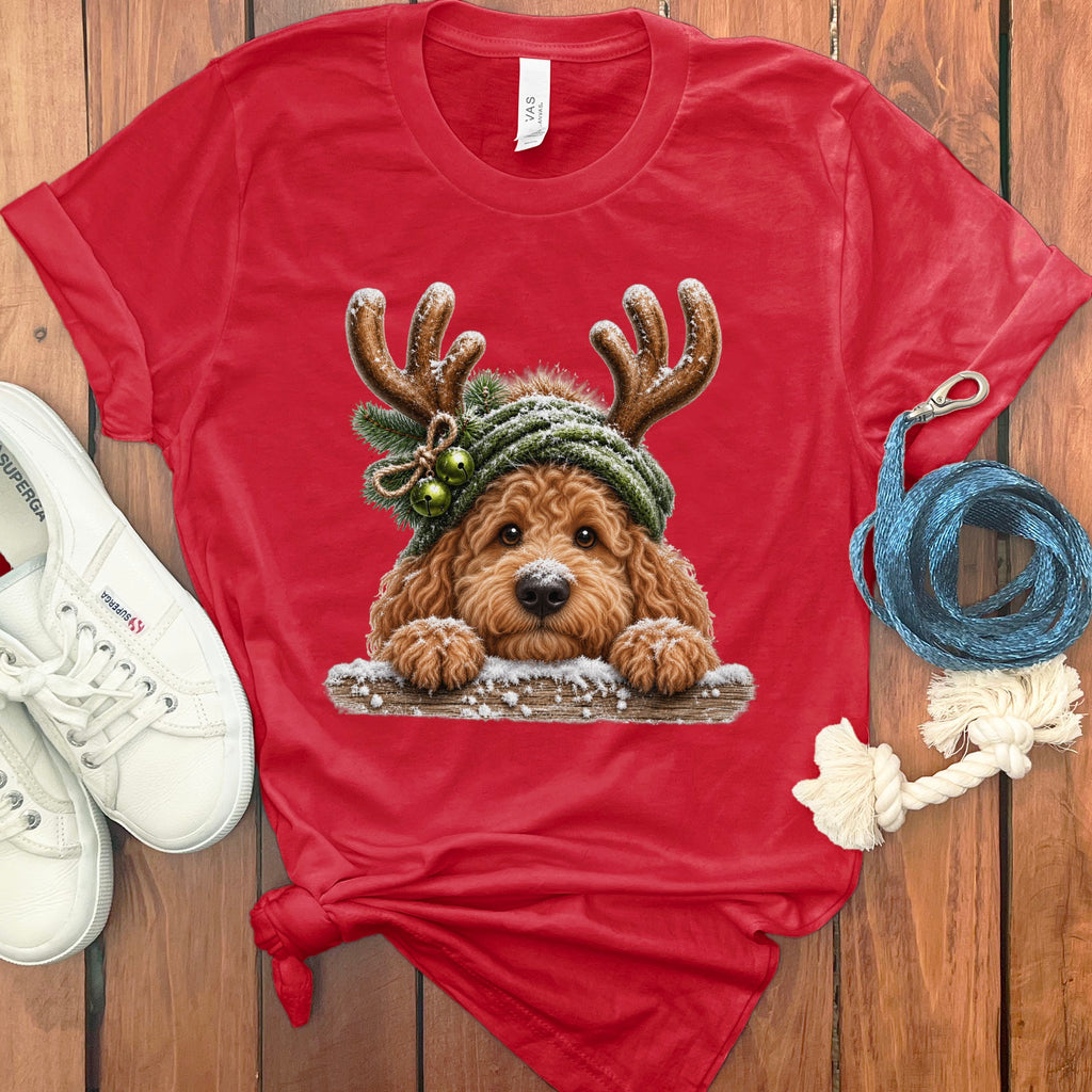 Red t-shirt with a cartoon dog wearing antlers and a green hat with bells.