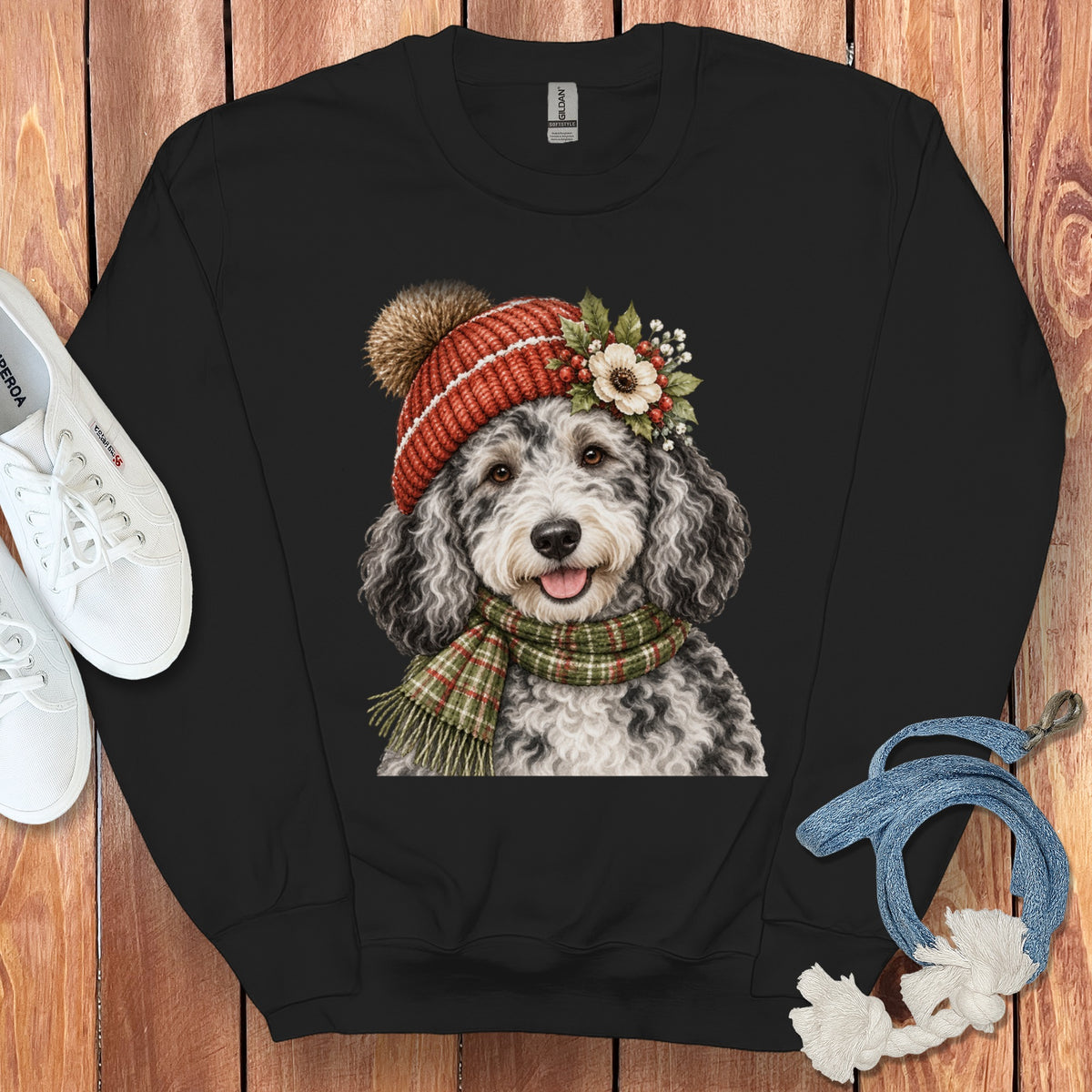 Black sweatshirt with a watercolor doodle dog wearing a knit hat and scarf.