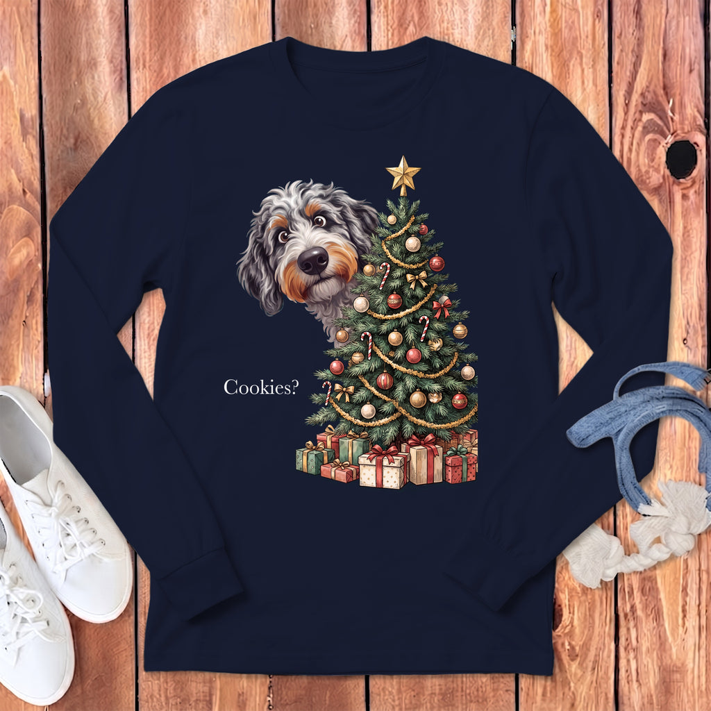 Dog peeking from behind Christmas tree with gifts and text "Cookies?".