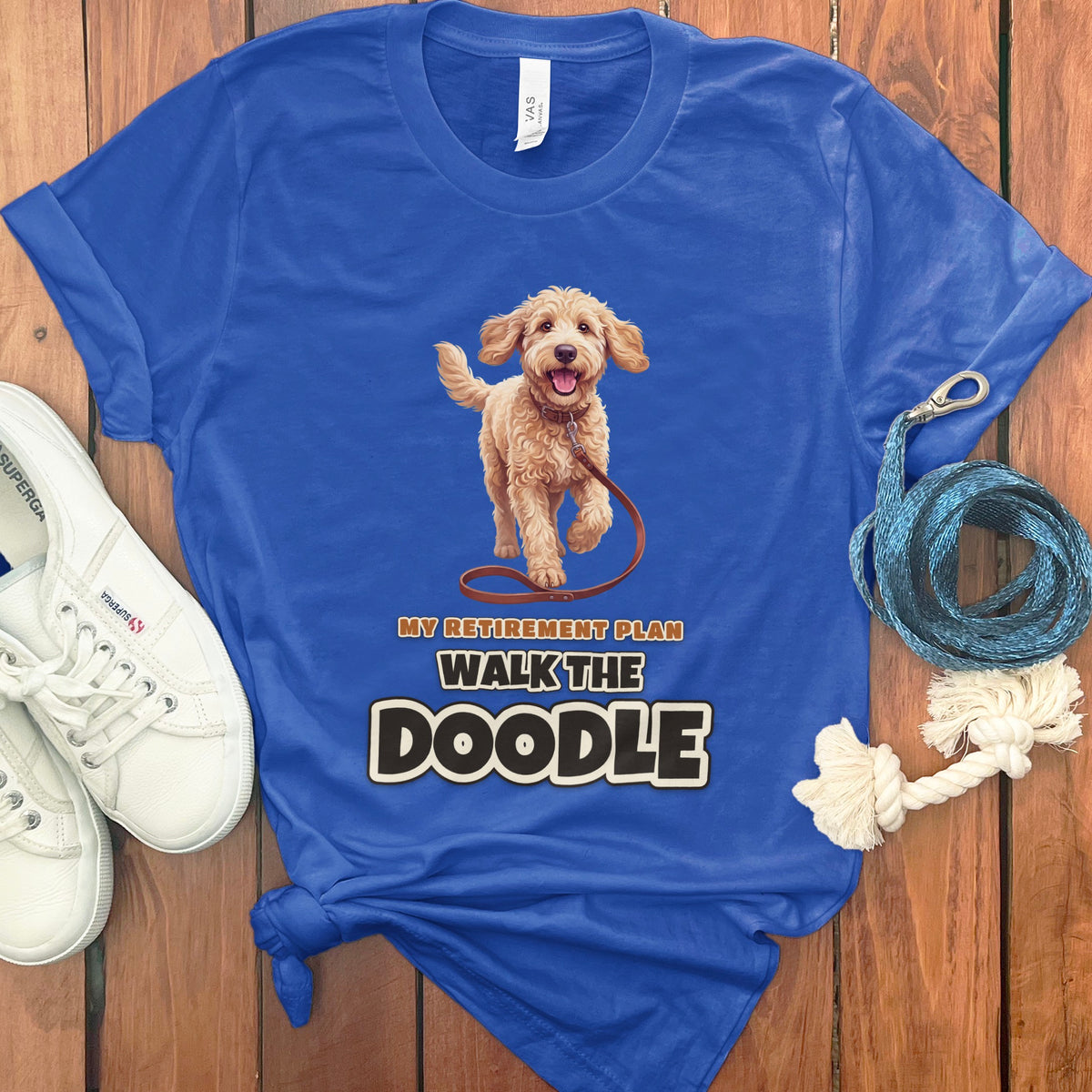 Blue t-shirt with doodle dog graphic and text "My Retirement Plan Walk The Doodle".