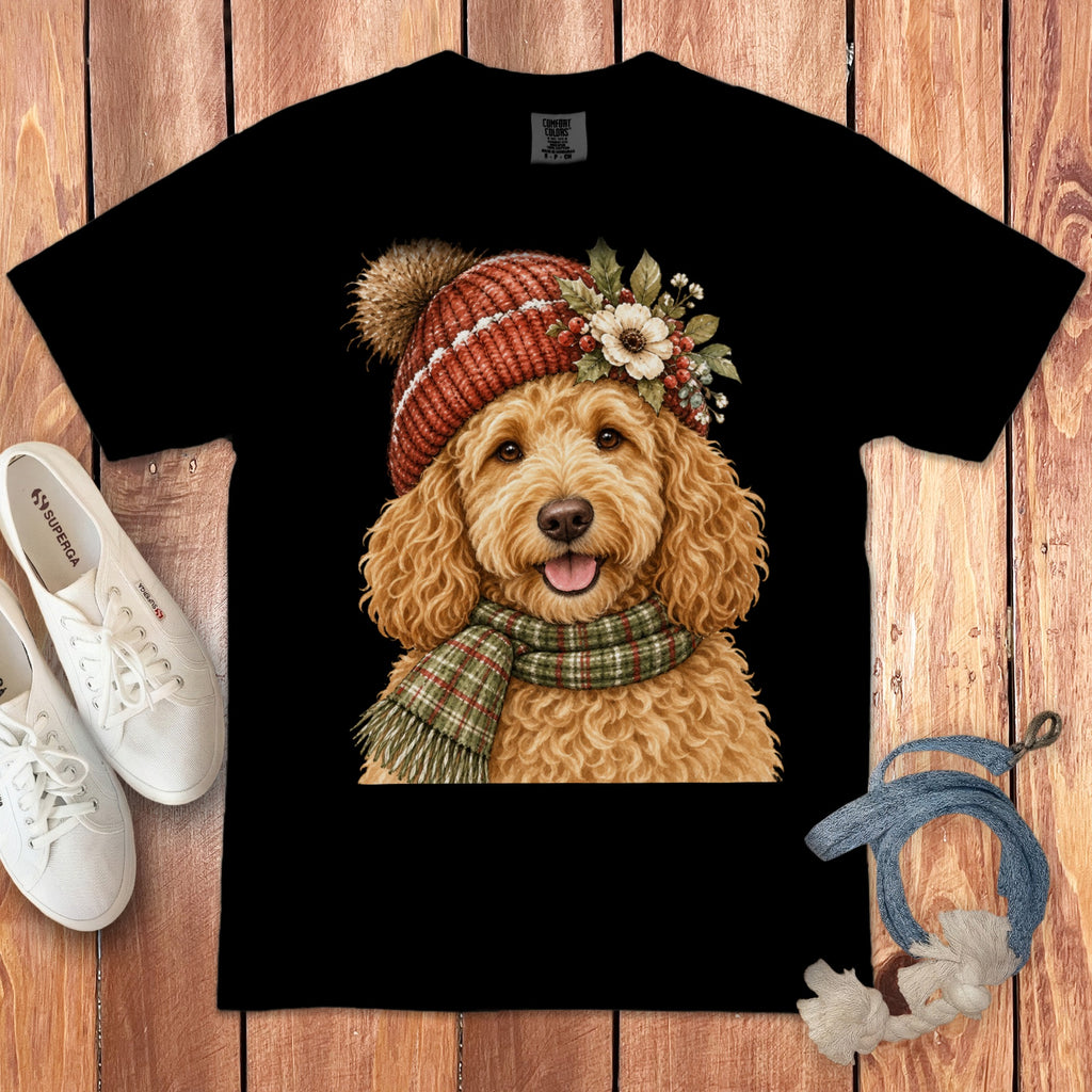Black t-shirt featuring a watercolor goldendoodle wearing a festive hat and scarf.