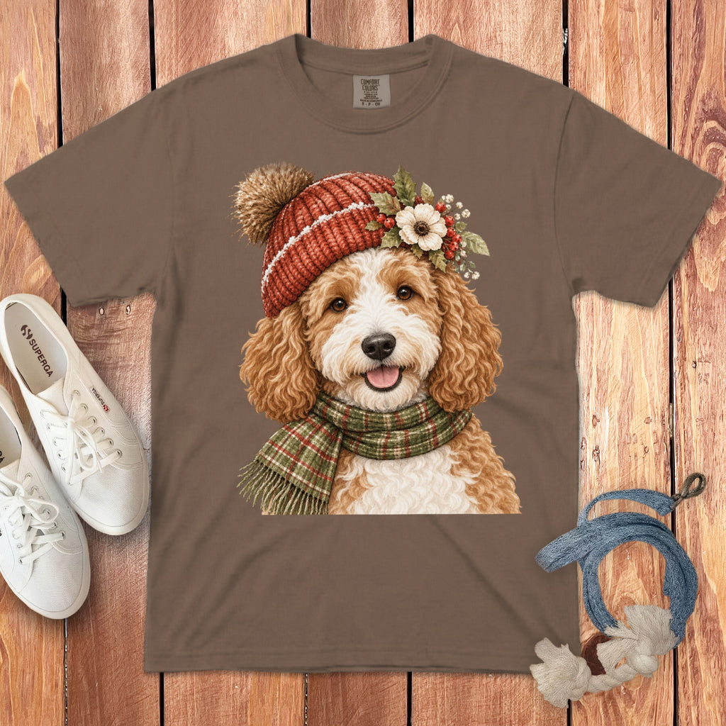 Brown t-shirt with a doodle dog wearing a festive hat and scarf, white sneakers, and rope toy.