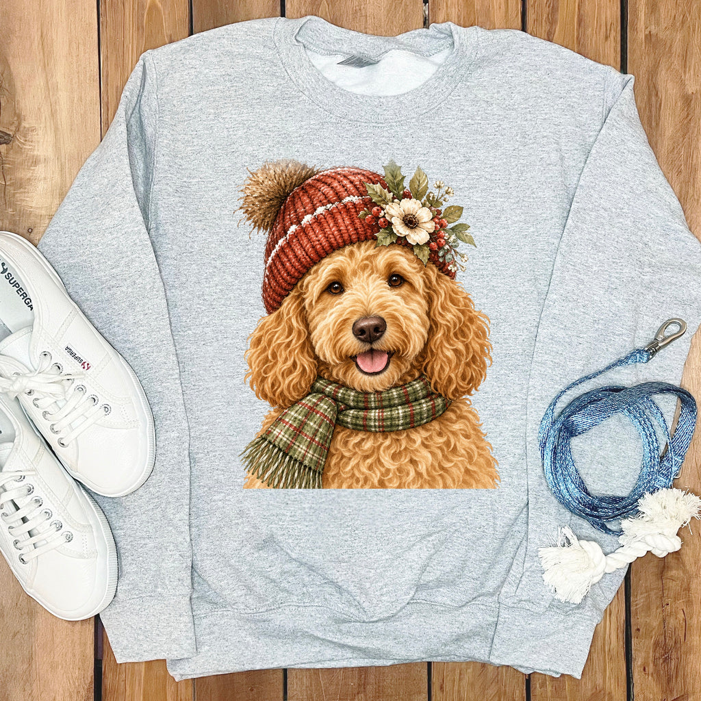Grey sweatshirt with a printed image of a fluffy dog wearing a winter hat and scarf.