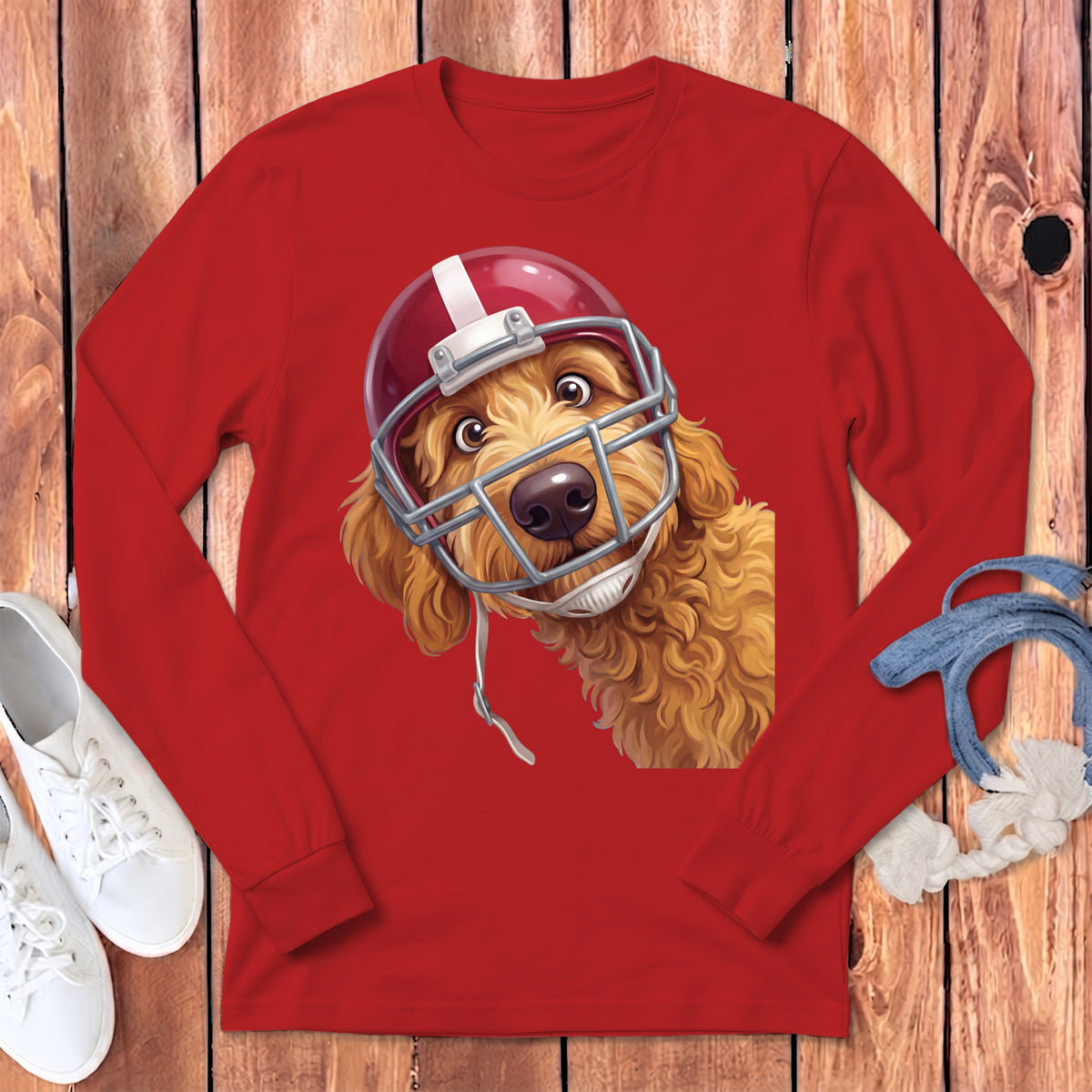 Red long-sleeve shirt with a goldendoodle wearing a football helmet graphic.