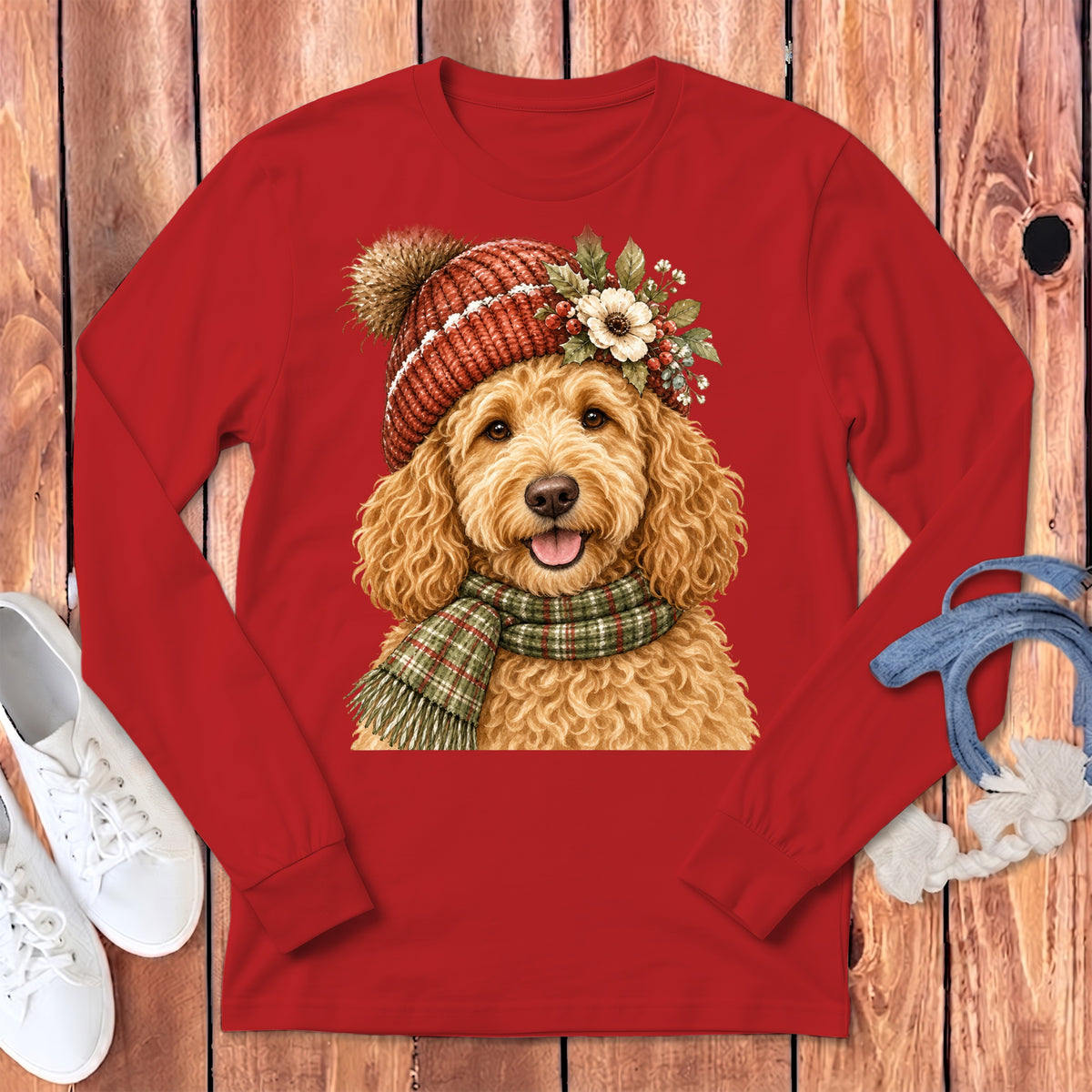 Red long-sleeve shirt featuring a watercolor painting of a goldendoodle dog wearing a hat and scarf.