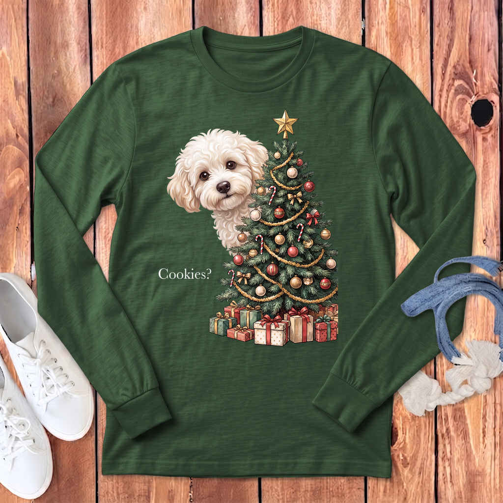 Green long sleeve shirt with a white dog peeking by a Christmas tree and gifts.