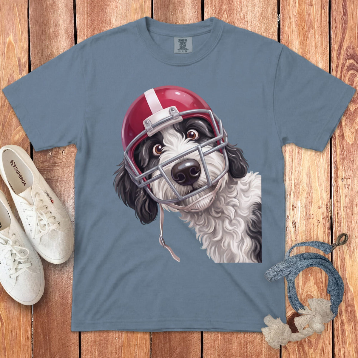 Gray t-shirt with a black and white dog wearing a red football helmet.