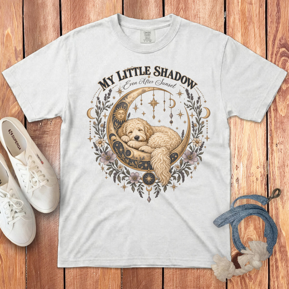 White t-shirt with graphic of dog sleeping on moon, "My Little Shadow" text.
