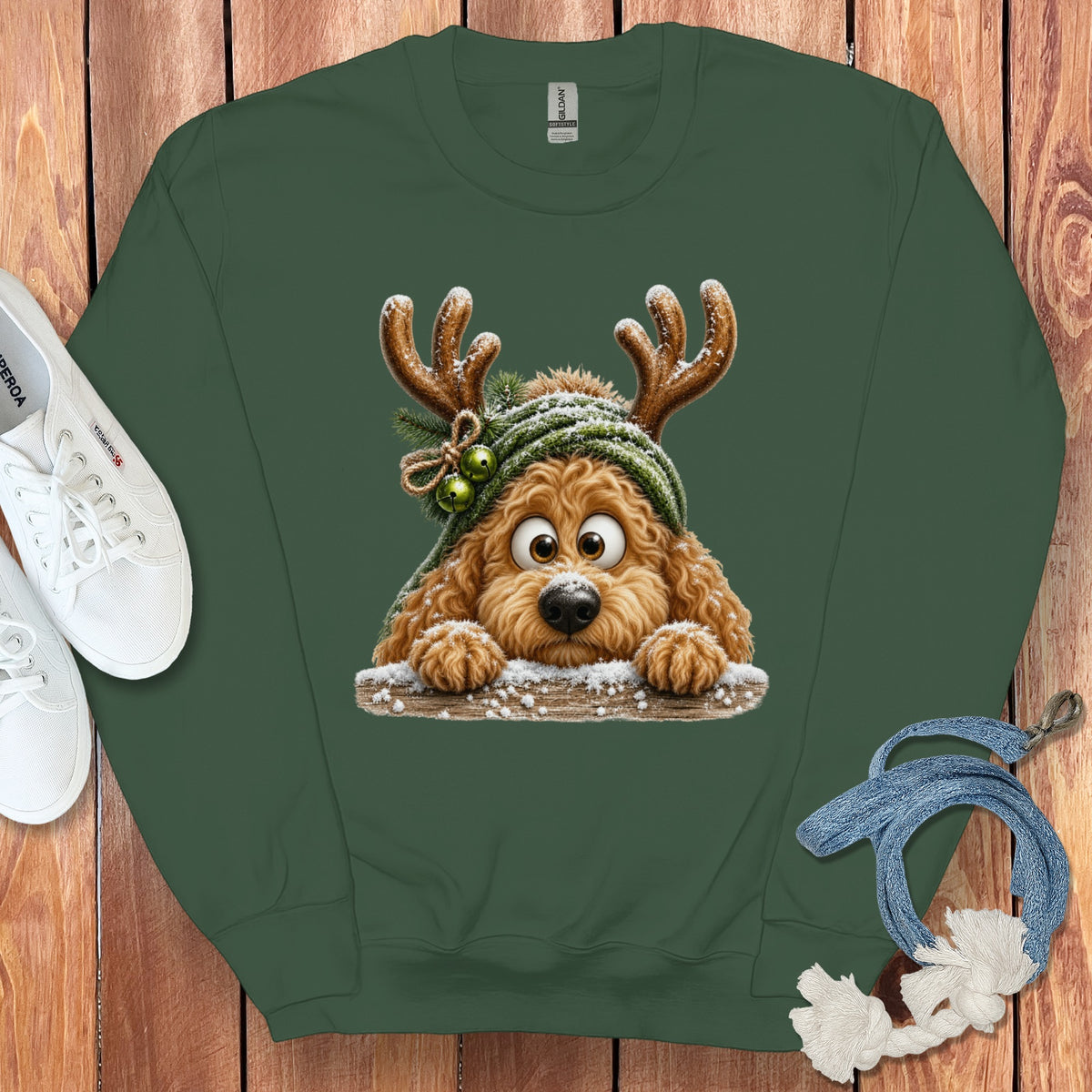 Green sweatshirt with a cartoon dog wearing reindeer antlers and a hat.