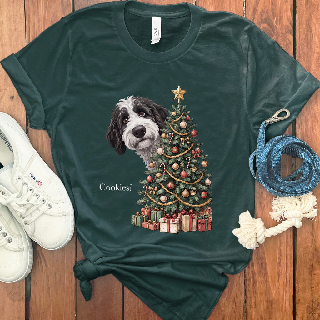 Dark green t-shirt with a doodle of a dog and Christmas tree asking "Cookies?".