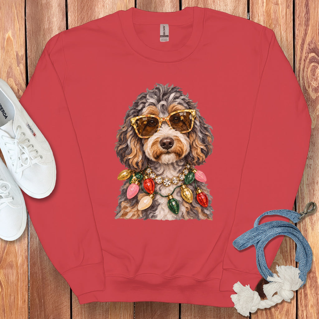 Sweatshirt with a doodle dog wearing sunglasses and a Christmas light necklace.
