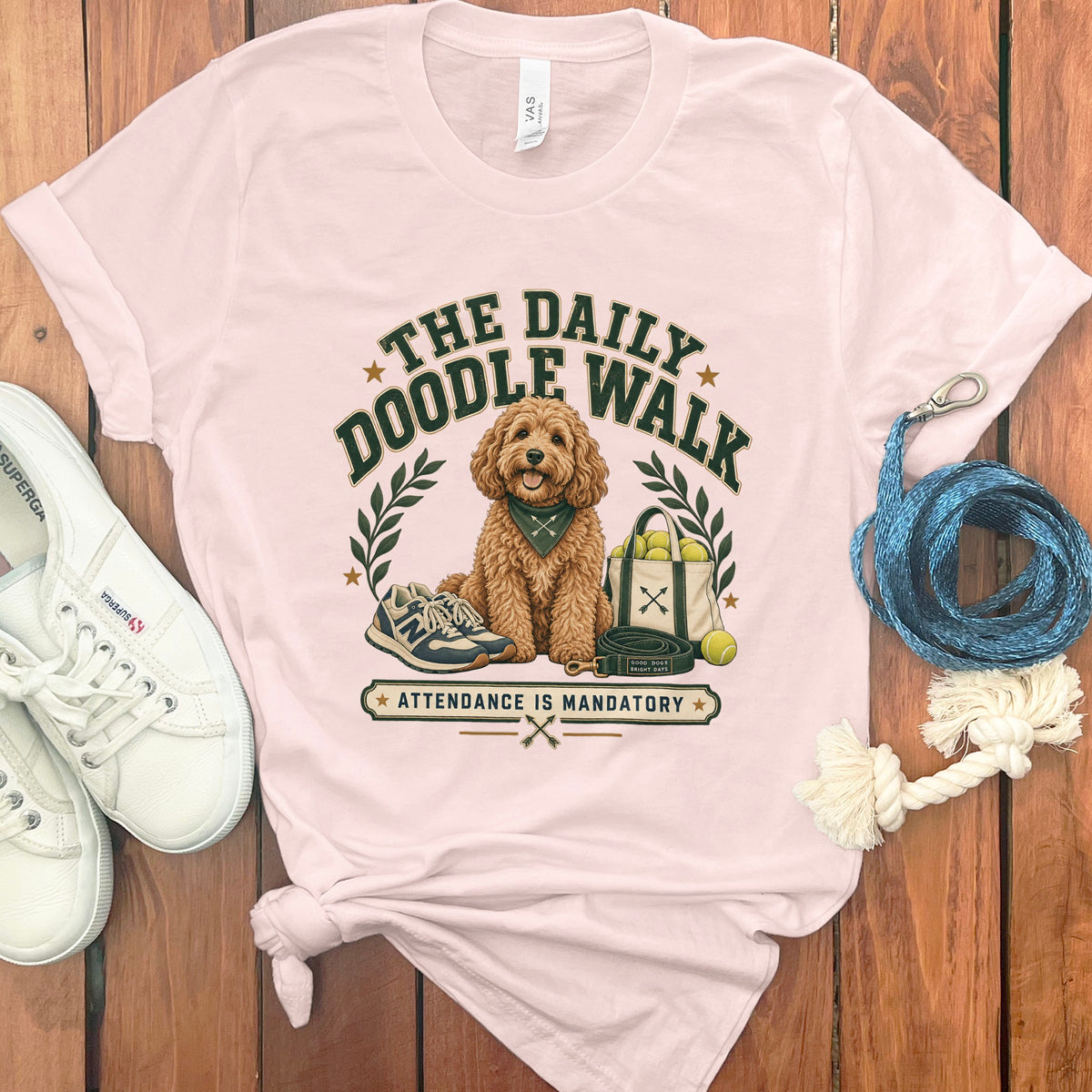 Light pink t-shirt with "The Daily Doodle Walk" and dog graphic.
