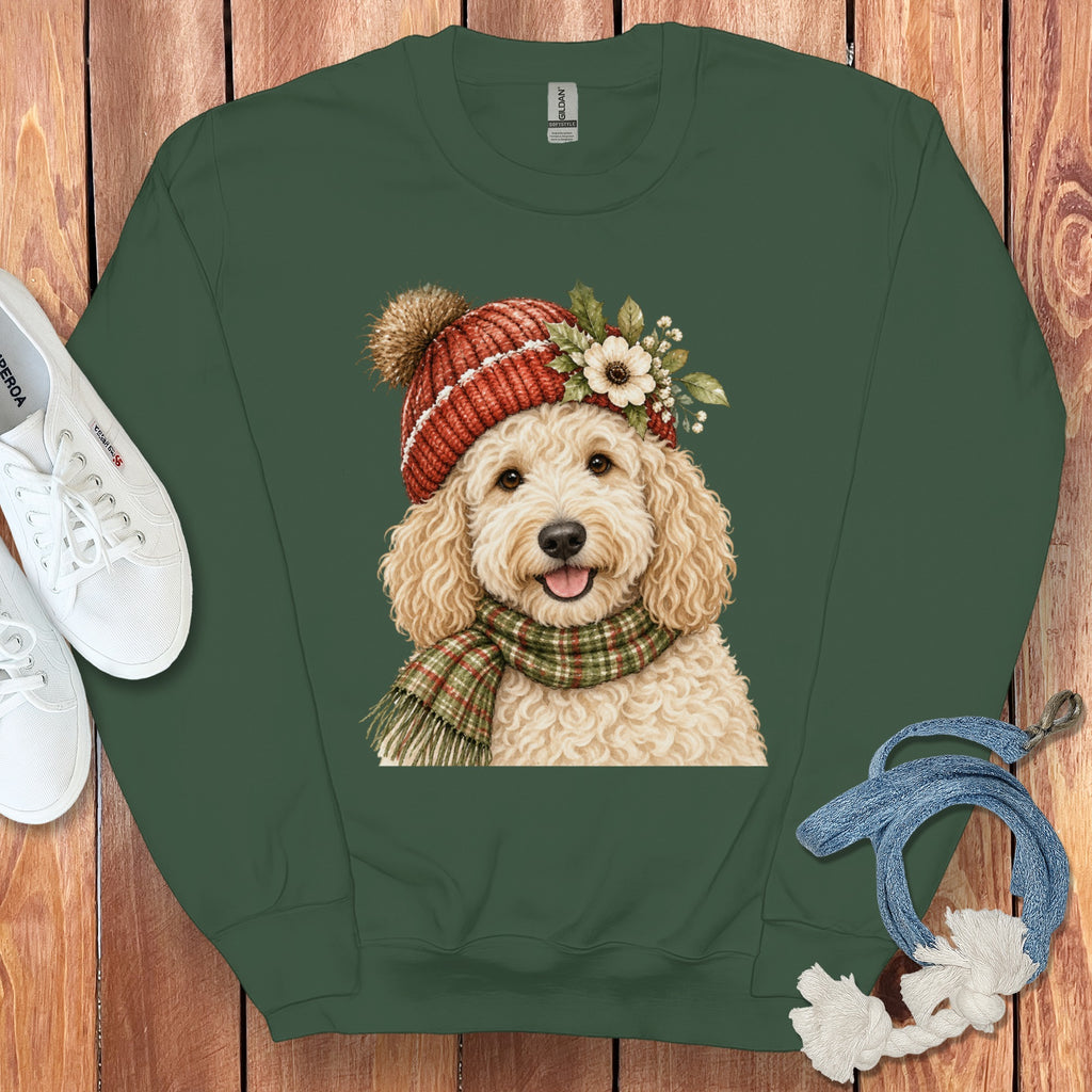 Green sweatshirt with watercolor illustration of a fluffy dog wearing a hat and scarf.
