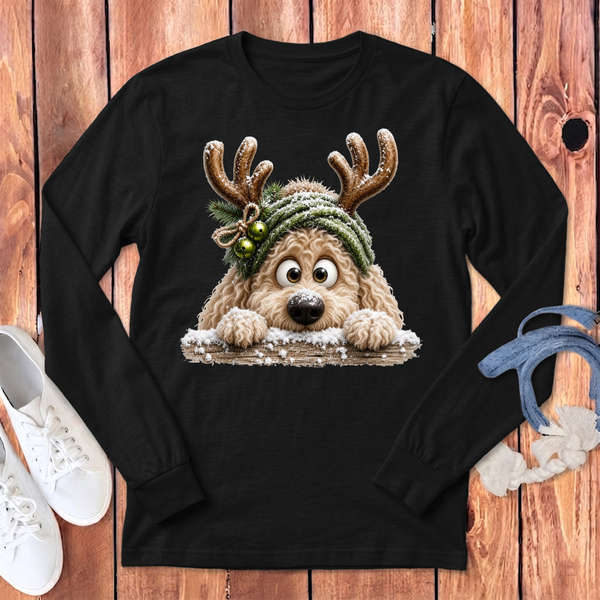 Black long-sleeve shirt with a cartoon doodle wearing reindeer antlers and a knitted hat.