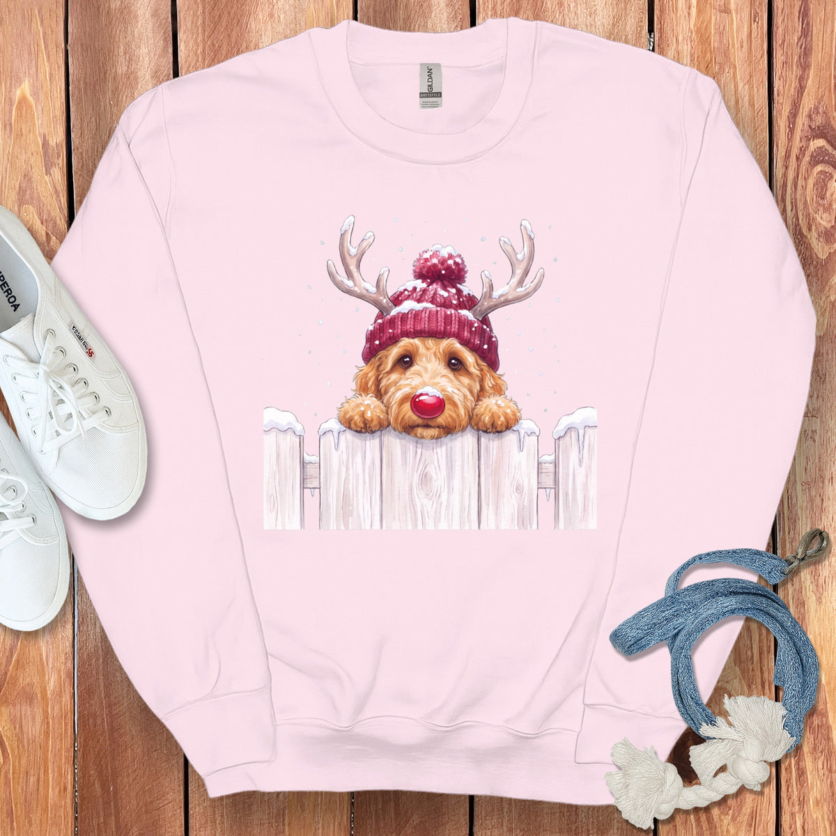 Pink sweatshirt with a doodle dog wearing a Santa hat and reindeer antlers.