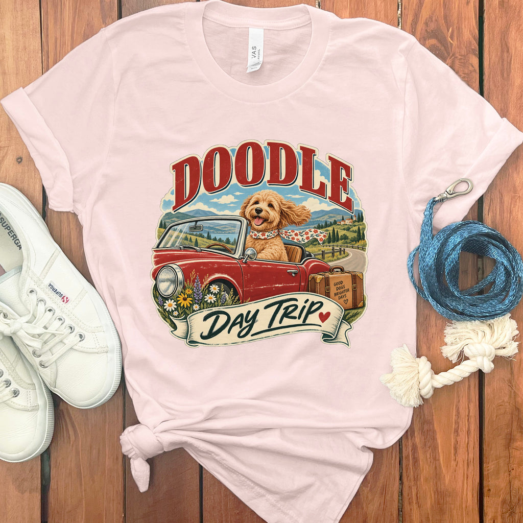 Doodle dog in convertible with "Day Trip" text and vintage suitcase graphic.