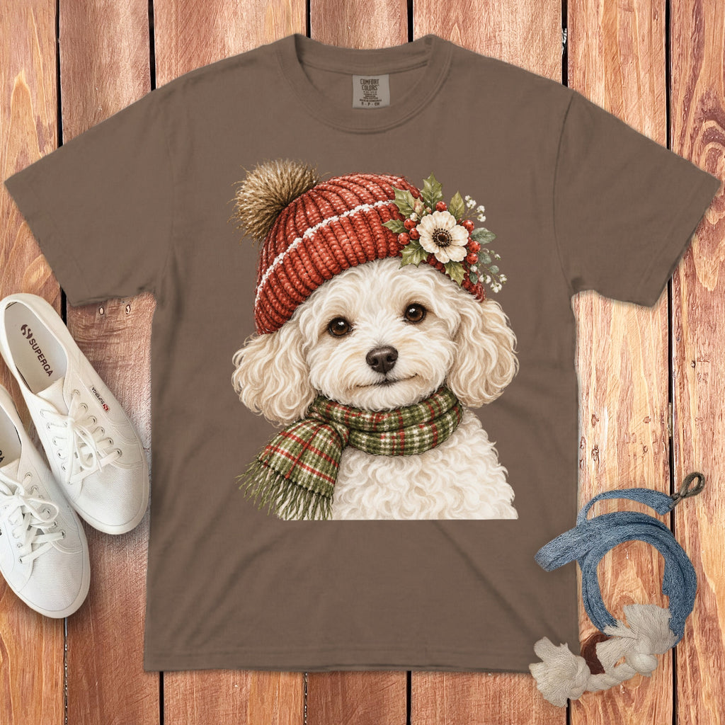 Brown t-shirt with watercolor of a dog wearing a red knit hat and plaid scarf.