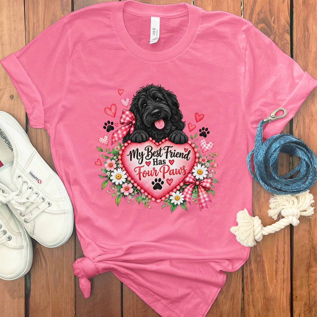 Pink t-shirt with a graphic of a black dog, flowers, hearts, and the text My Best Friend Has Four Paws.