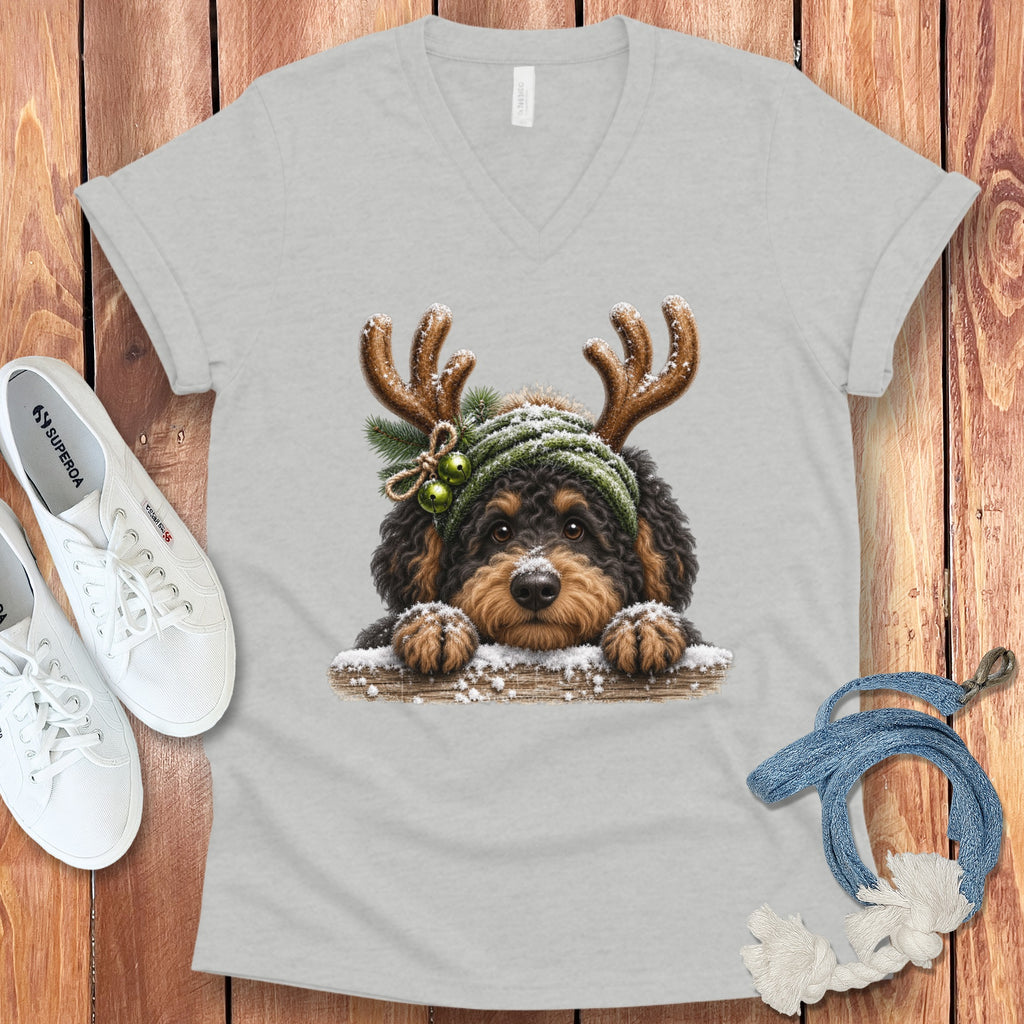 Light grey v-neck t-shirt with a printed graphic of a dog wearing reindeer antlers and a winter hat.