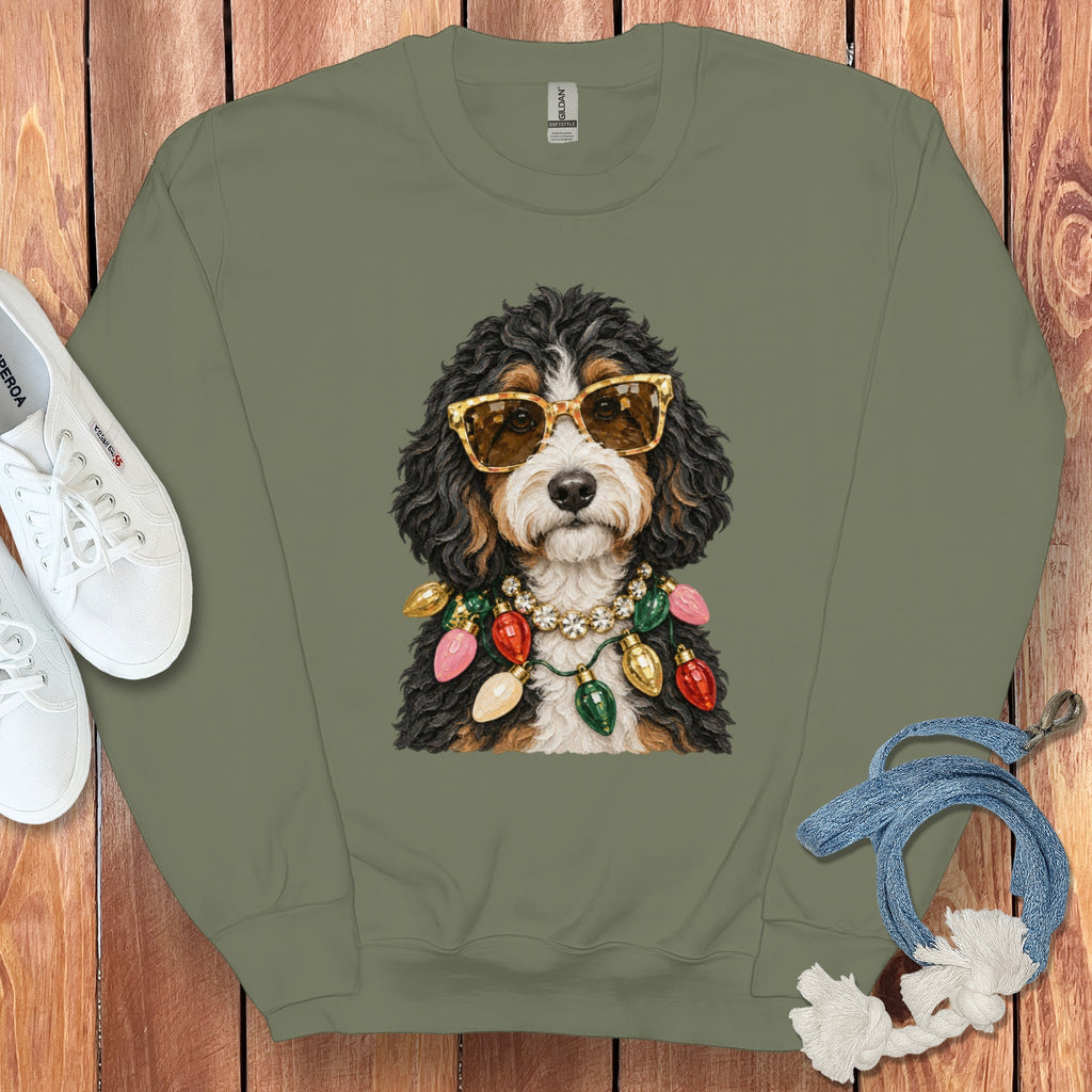 Bernese Mountain Dog wearing sunglasses and Christmas lights around its neck.