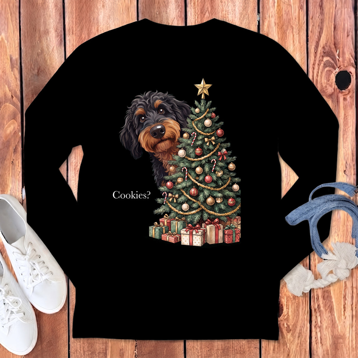 Black long-sleeve shirt with a wirehaired dachshund peeking behind a decorated Christmas tree and gifts.