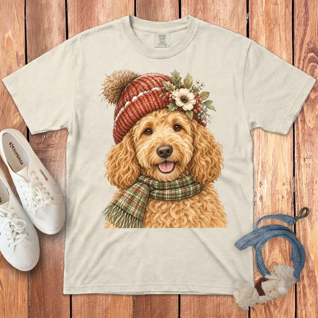 Light-colored t-shirt with watercolor doodle wearing a festive hat and scarf.