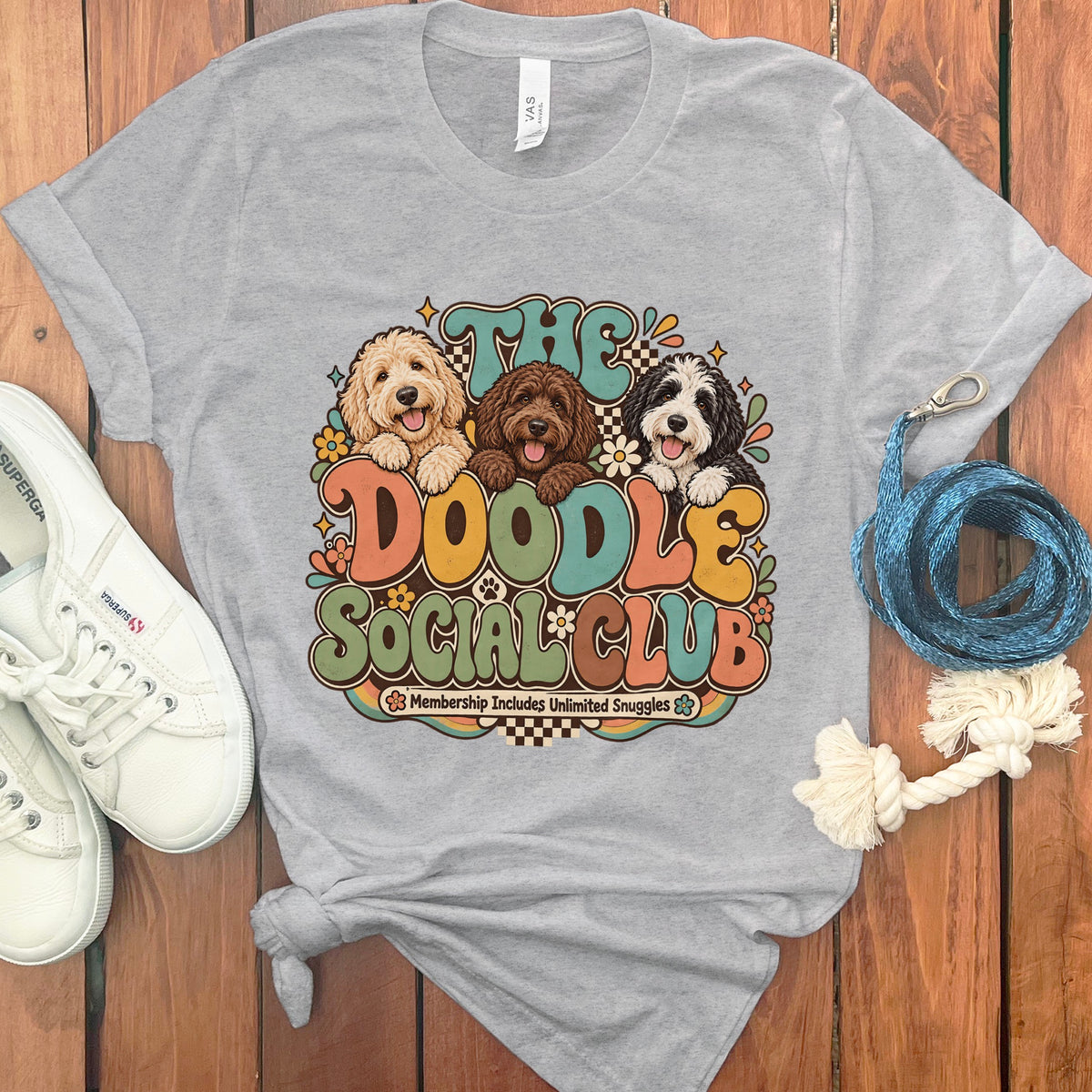 Grey t-shirt with "The Doodle Social Club" text and three doodles.