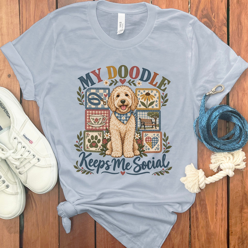 Light blue t-shirt with a doodle dog design and text "MY DOODLE Keeps Me Social".